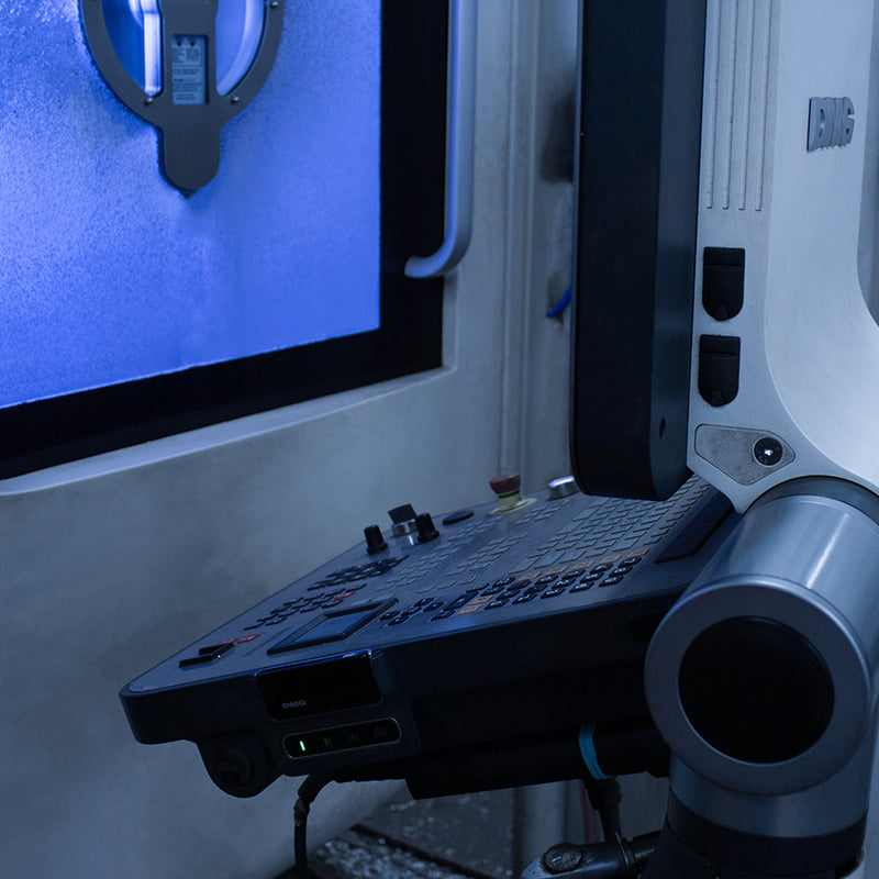 Close-up of a 5-axis CNC mill in operation